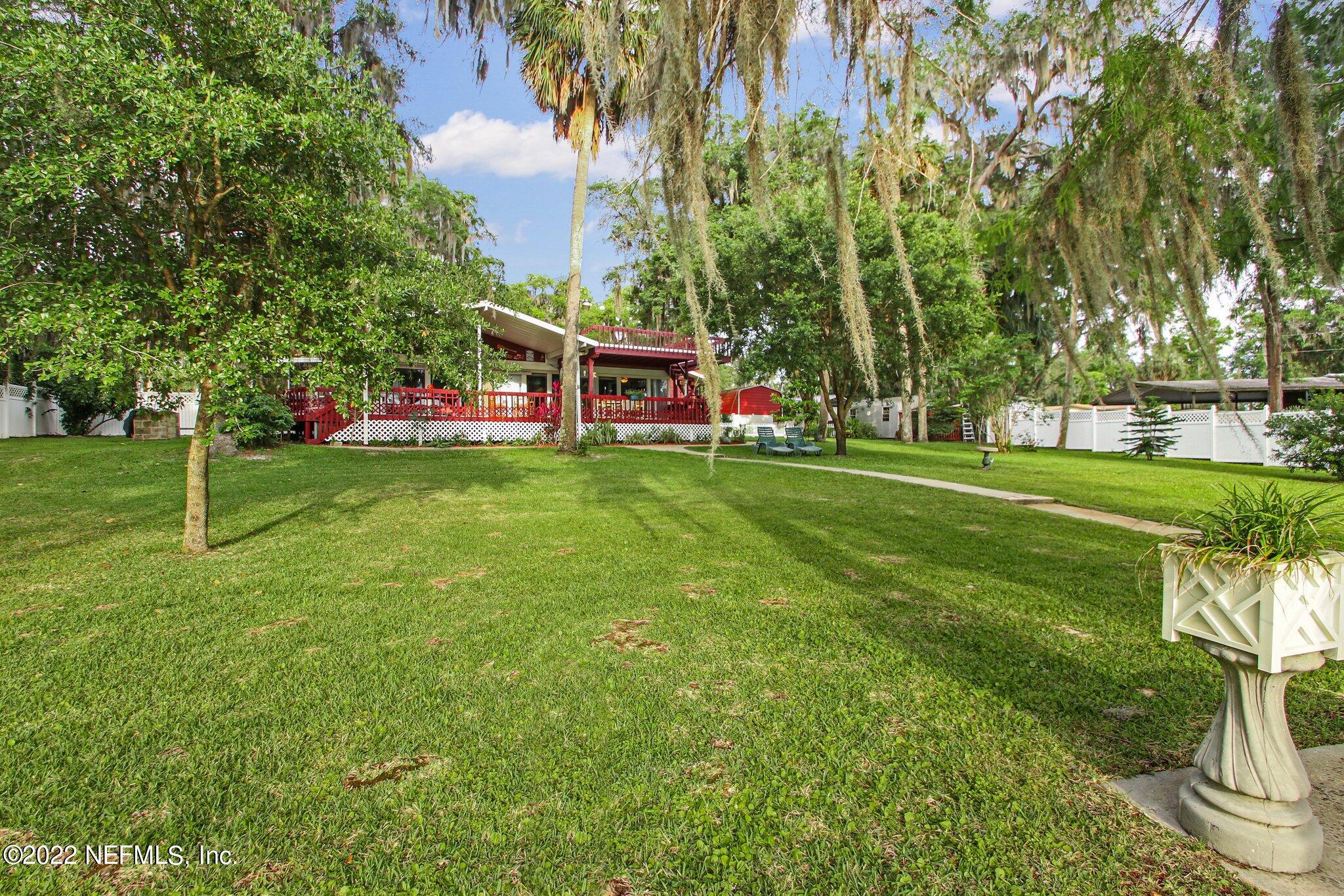 101 Orange Street Satsuma, FL 32189 - Photo 49 of 67 a front view of a house with a garden