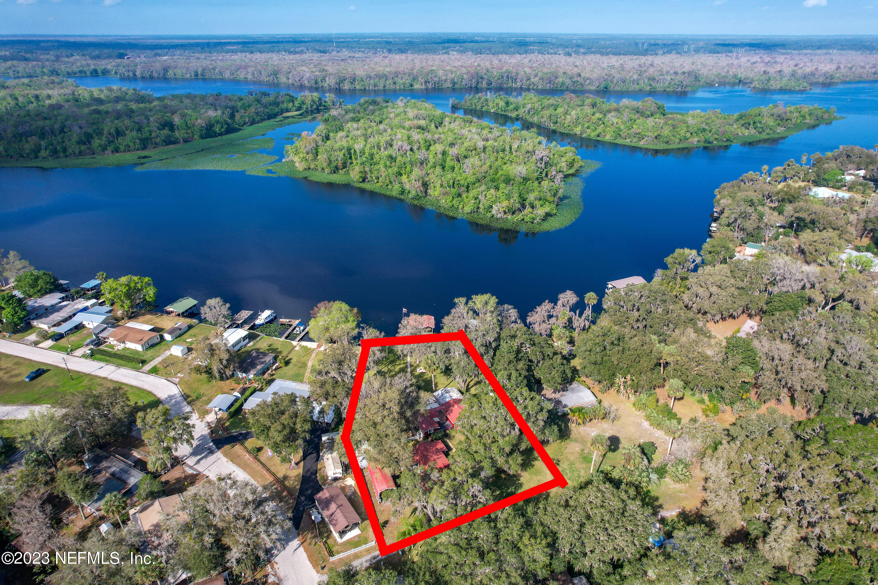 101 Orange Street Satsuma, FL 32189 - Photo 57 of 67 a view of a lake with a mountain in the back