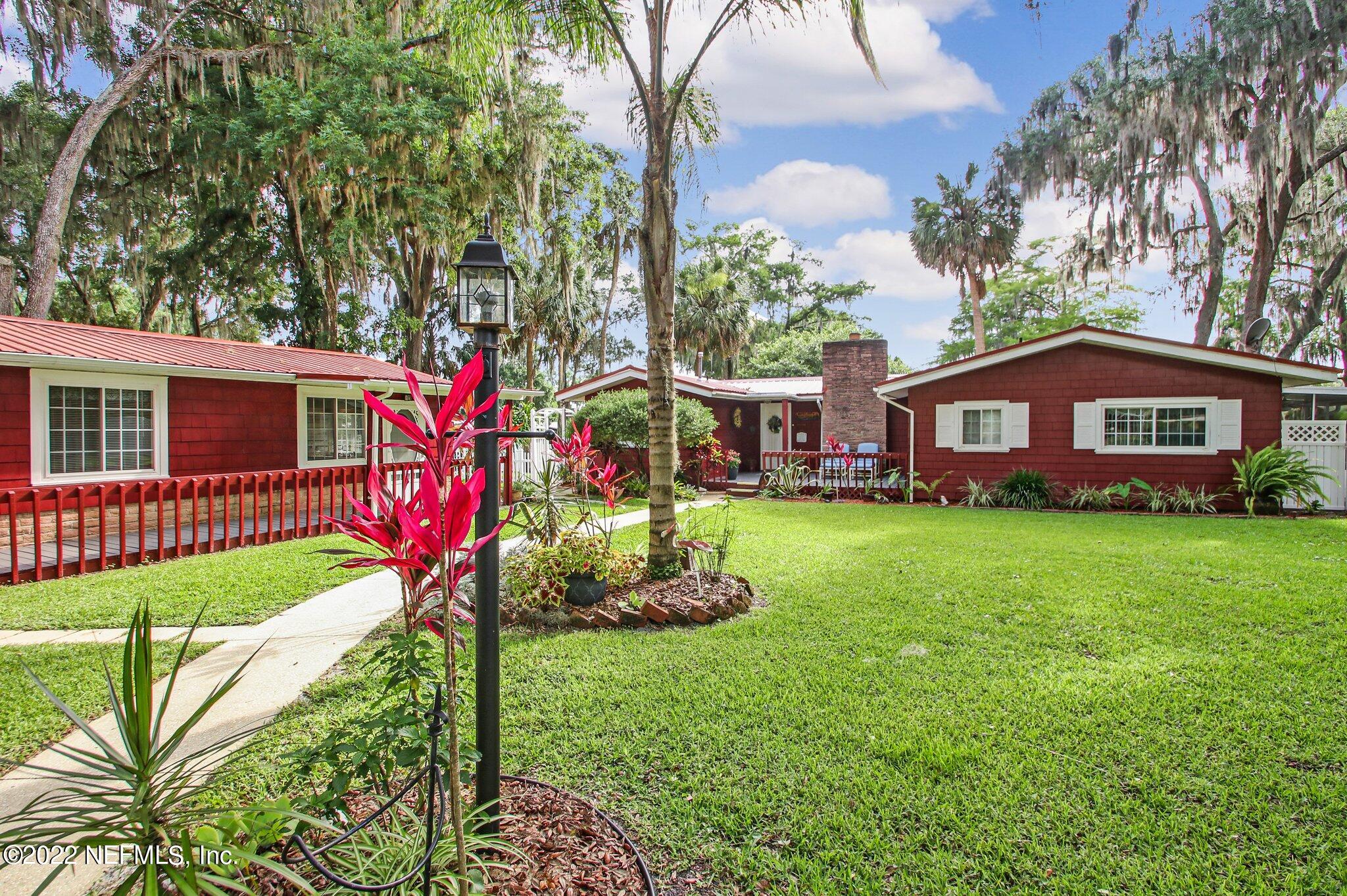 101 Orange Street Satsuma, FL 32189 - Photo 59 of 67 a front view of a house with a yard and fountain
