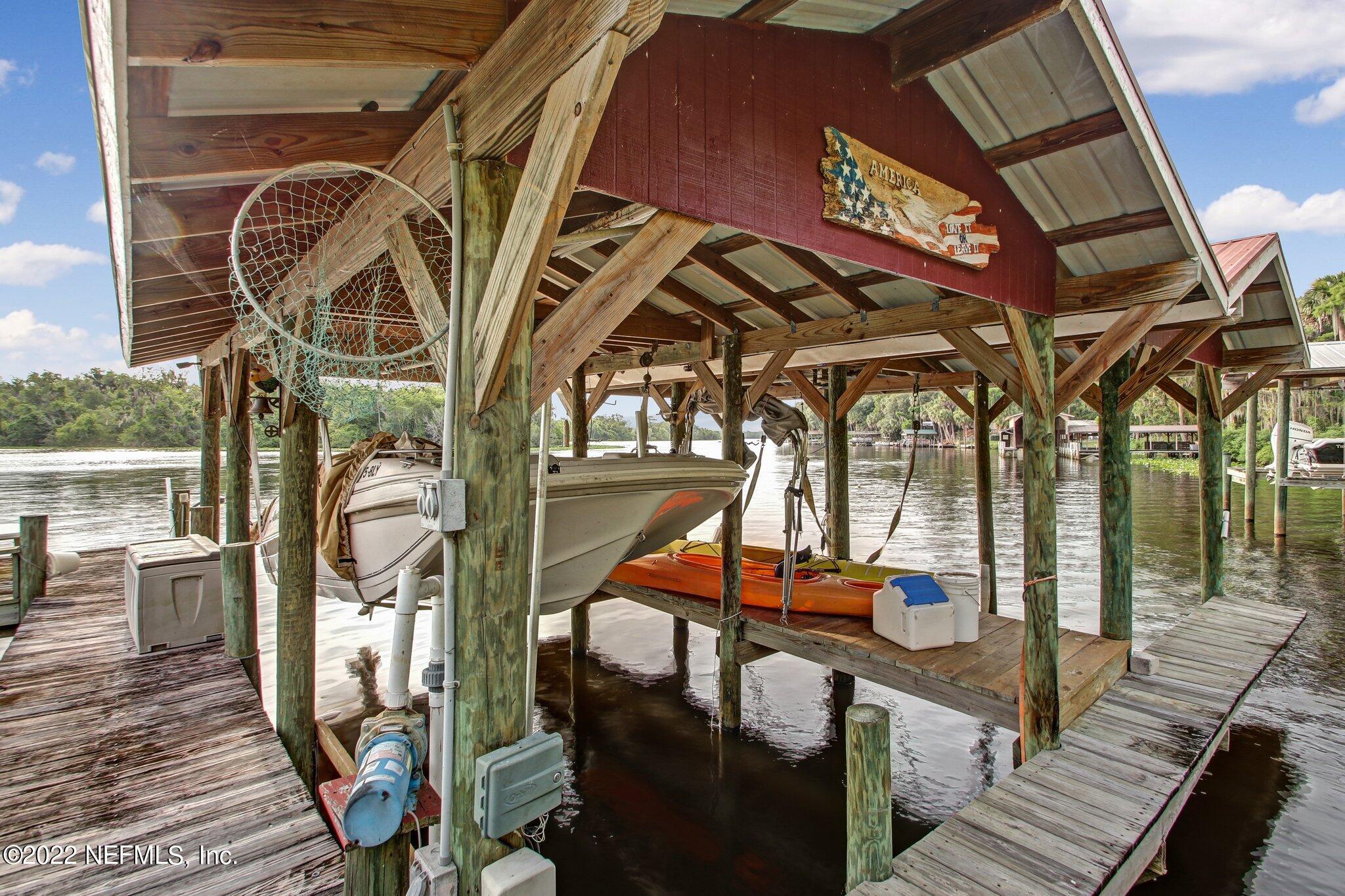 101 Orange Street Satsuma, FL 32189 - Photo 61 of 67 a view of a balcony with wooden floor