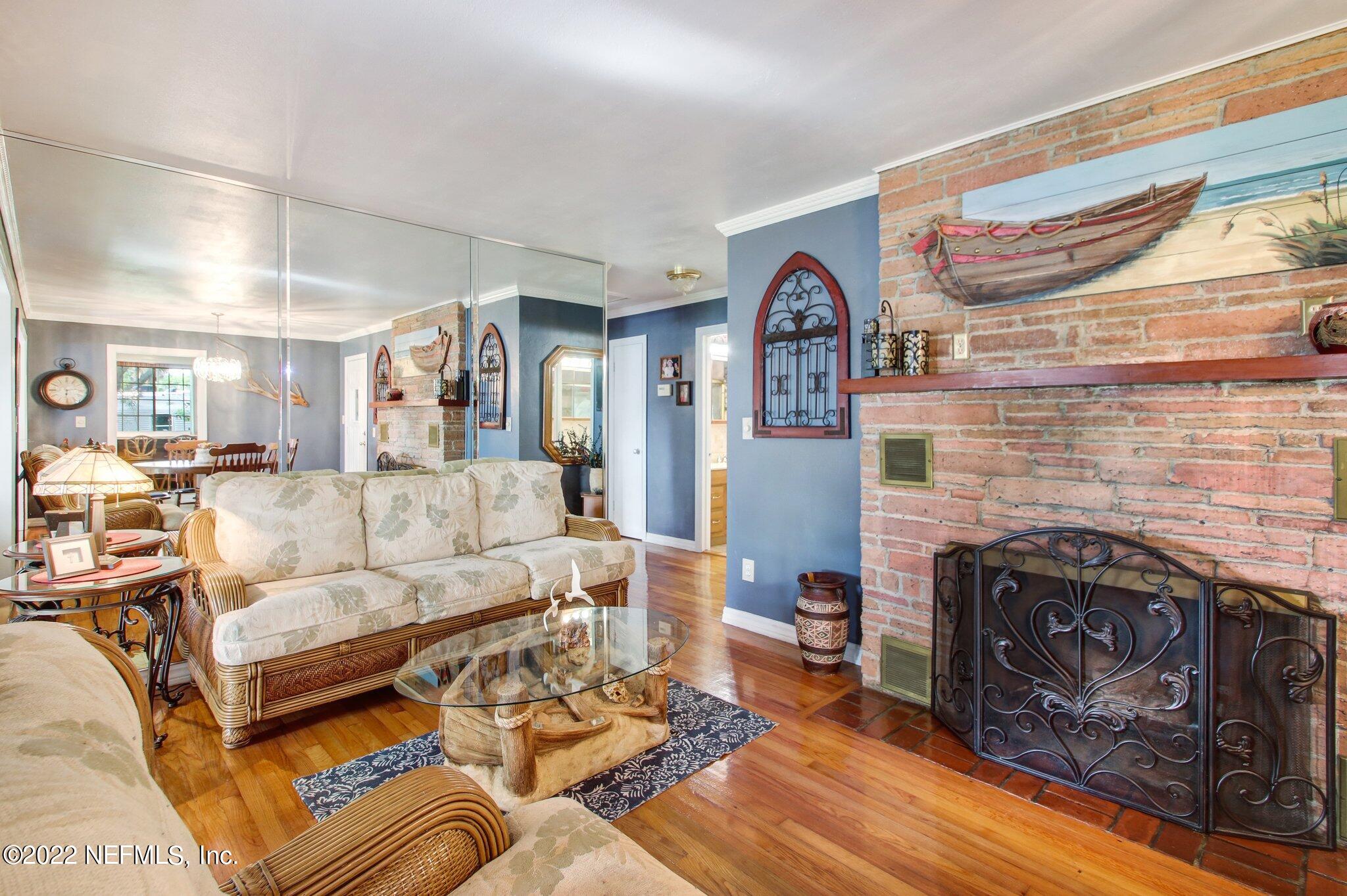 101 Orange Street Satsuma, FL 32189 - Photo 8 of 67 a living room with furniture and a fireplace