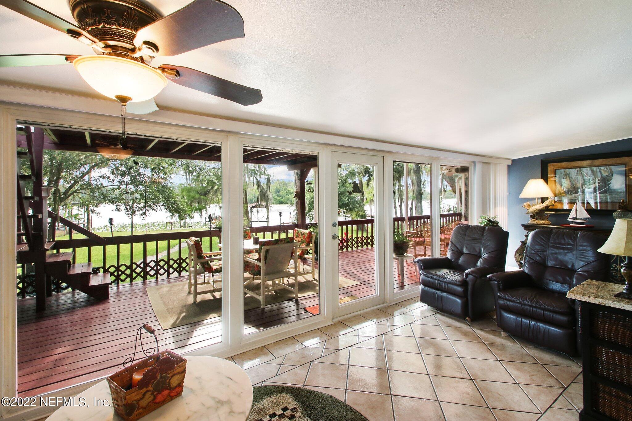 101 Orange Street Satsuma, FL 32189 - Photo 10 of 67 a living room with large windows