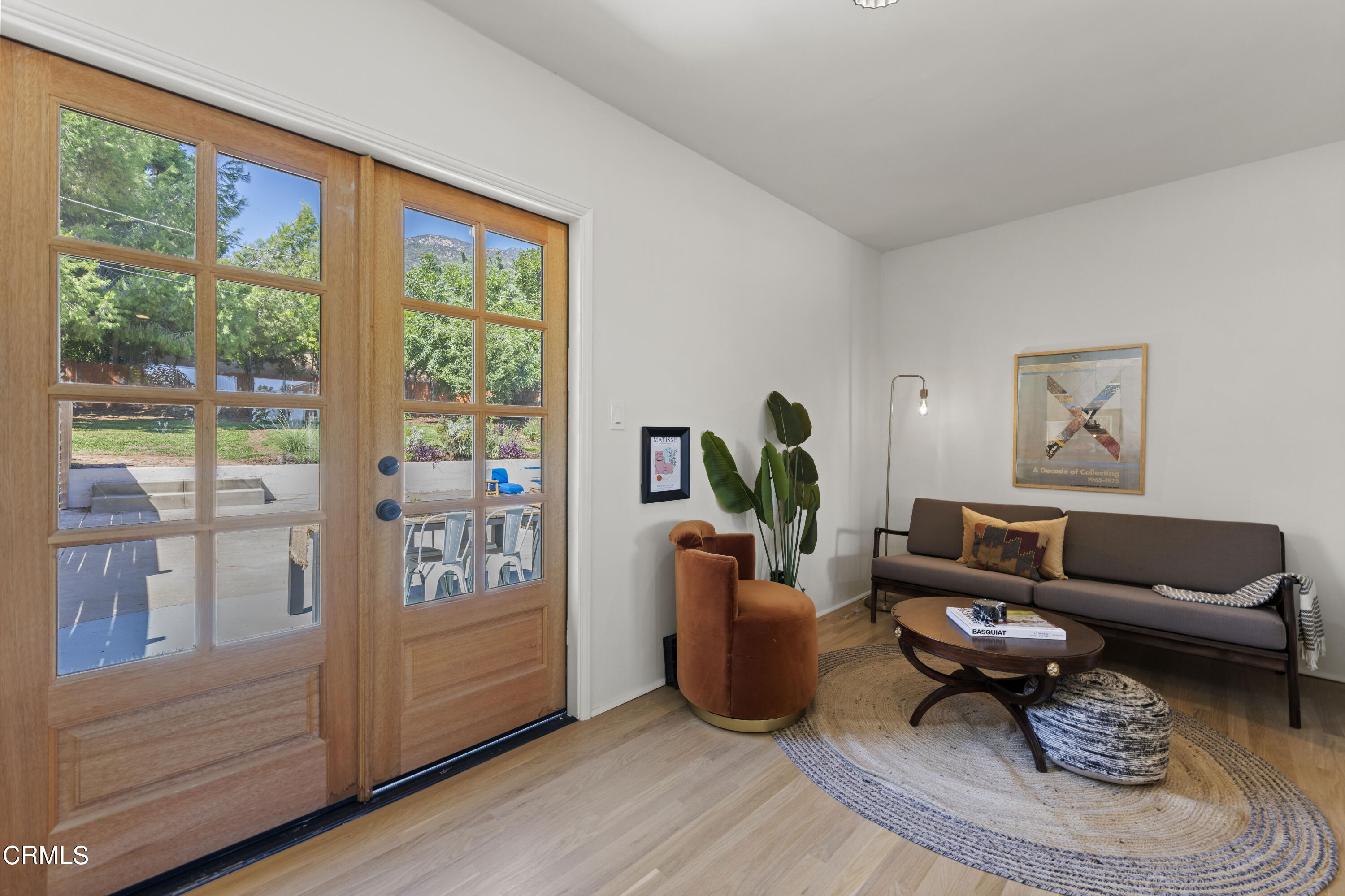 1887 Homewood Drive Altadena, CA 91001 - Photo 11 of 27 a living room with furniture and a large window