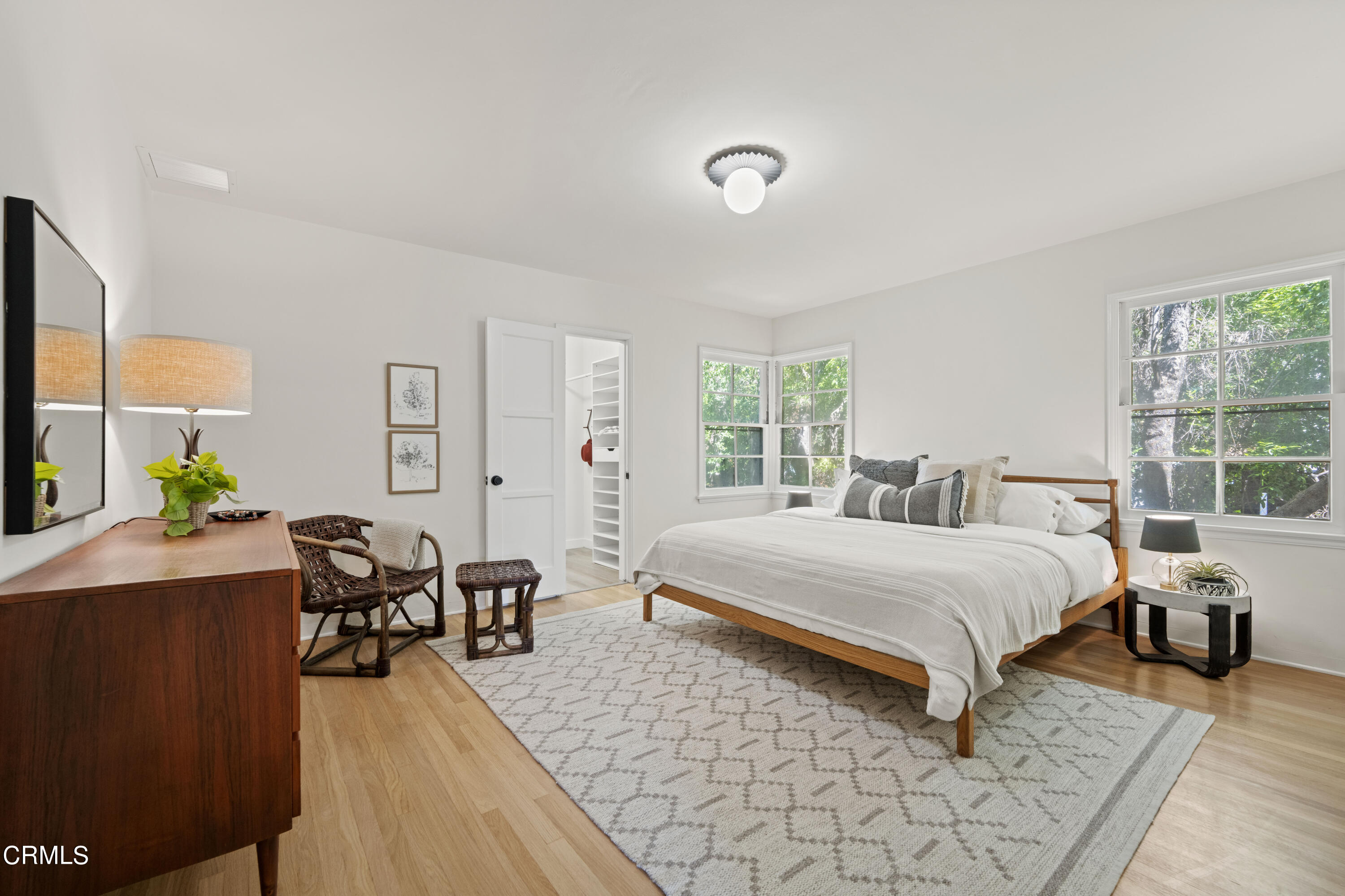 1887 Homewood Drive Altadena, CA 91001 - Photo 13 of 27 a bedroom with a bed and wooden floor