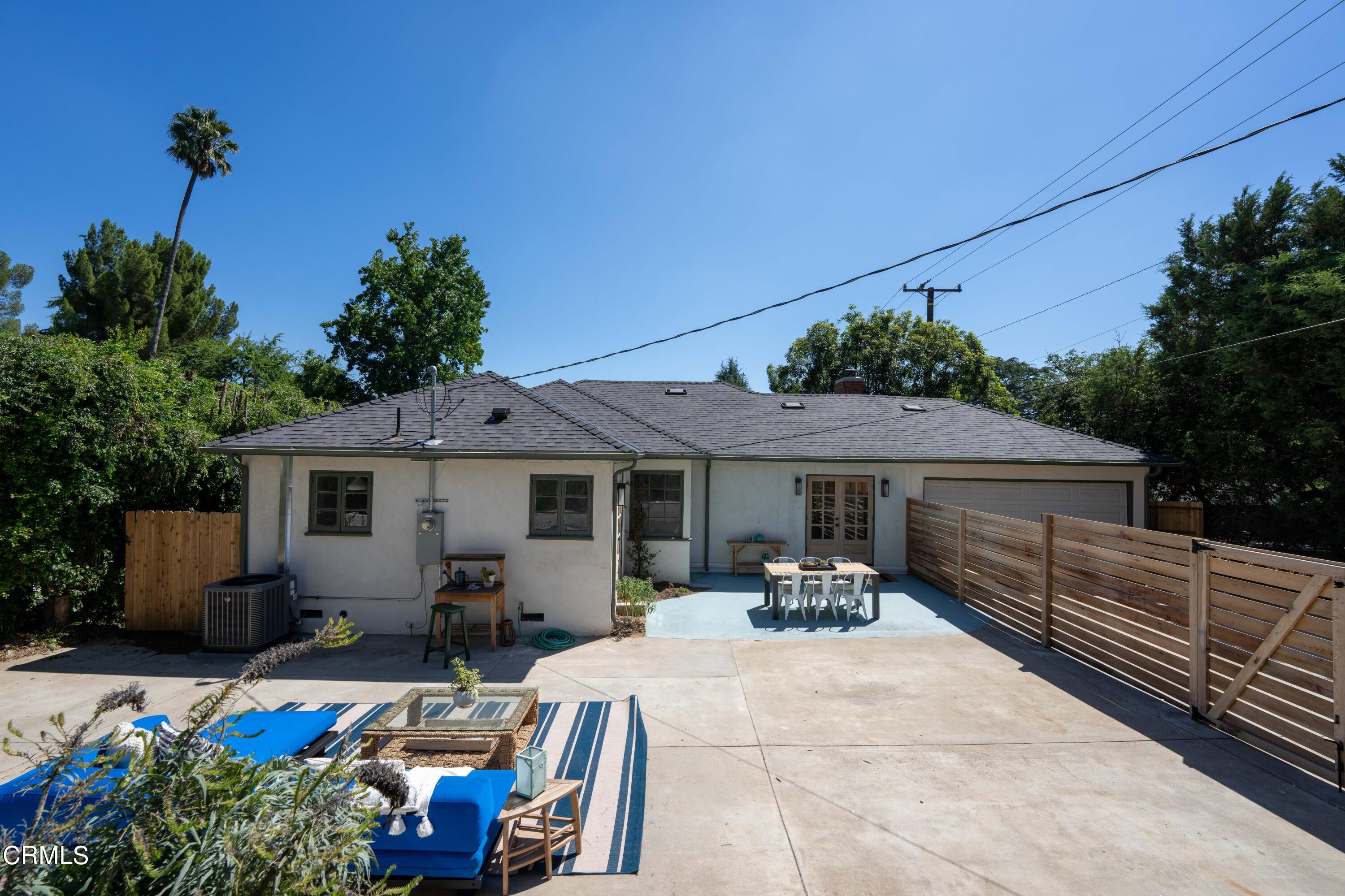 1887 Homewood Drive Altadena, CA 91001 - Photo 24 of 27 a view of a patio with furniture potted plants and large tree