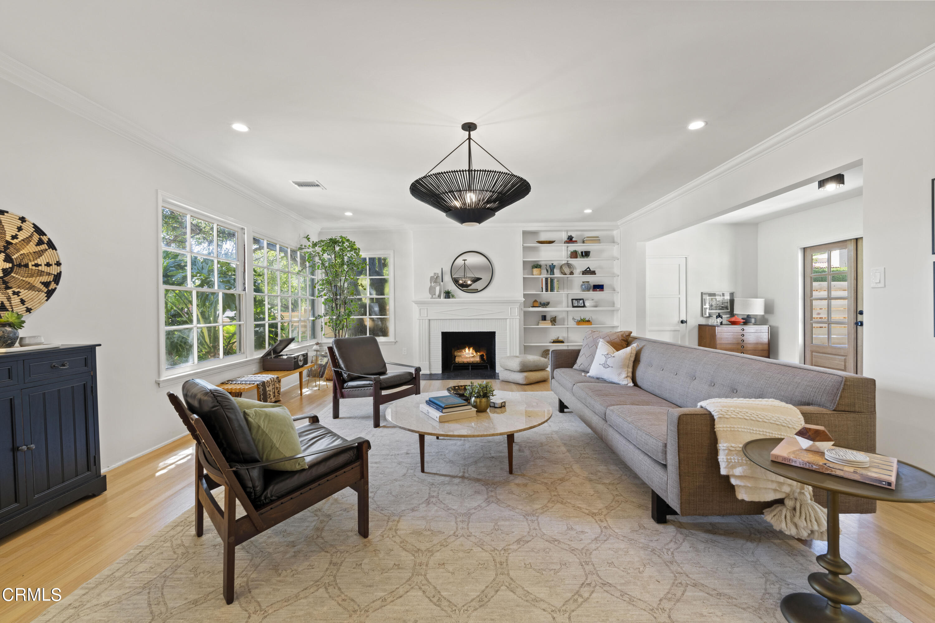 1887 Homewood Drive Altadena, CA 91001 - Photo 6 of 27 a living room with furniture a fireplace and a chandelier