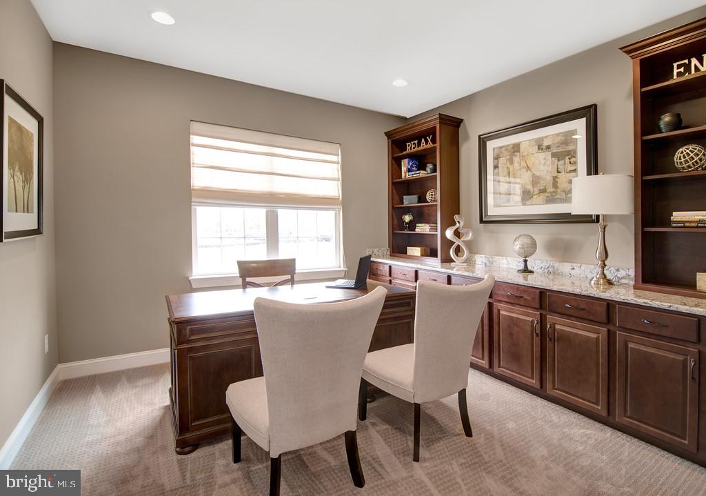 400 Rederick Lane, Unit 1 Middletown, DE 19709 - Photo 21 of 39 a dining room with a wooden table and chairs