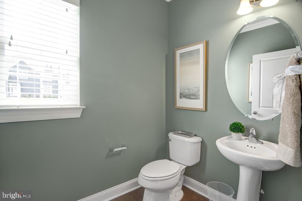 400 Rederick Lane, Unit 1 Middletown, DE 19709 - Photo 22 of 39 a bathroom with a toilet sink and mirror