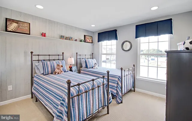 a bedroom with a bed next to a window with the outer view