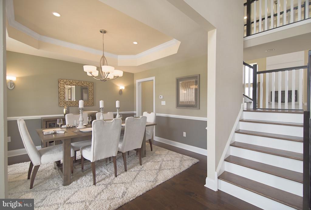 400 Rederick Lane, Unit 1 Middletown, DE 19709 - Photo 3 of 39 a view of a dining room with furniture and wooden floor