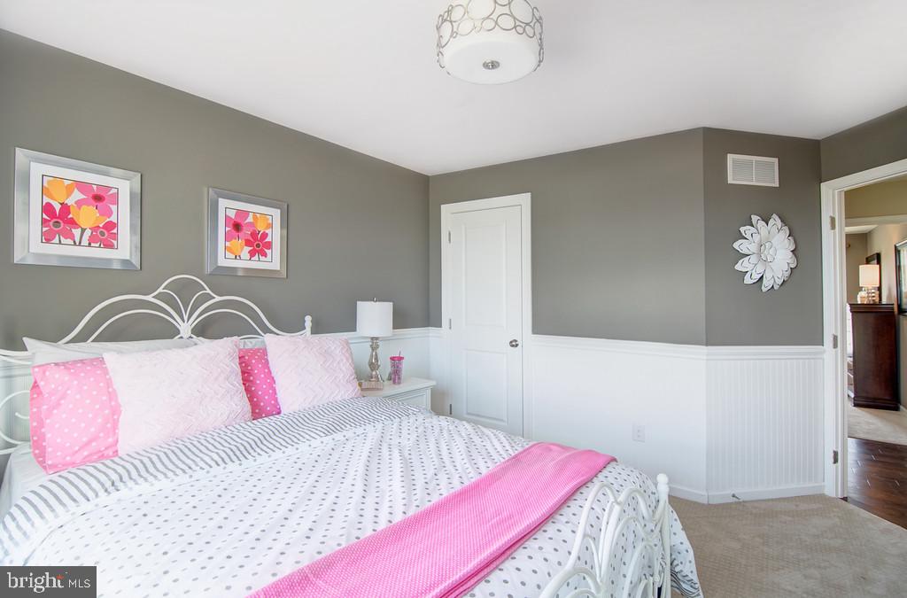 400 Rederick Lane, Unit 1 Middletown, DE 19709 - Photo 32 of 39 a bedroom with a bed and a flat screen tv