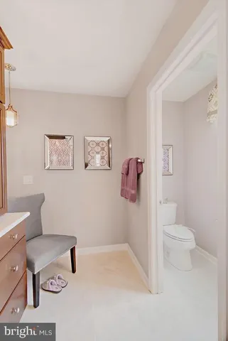 a bathroom with a toilet a sink and a shower