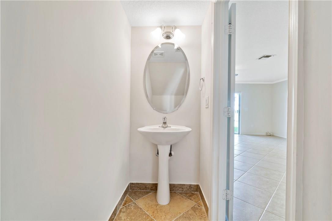 5905 Abbey Road, Unit 5905 Tamarac, FL 33321 - Photo 12 of 28 HALF BATH DOWNSTAIRS