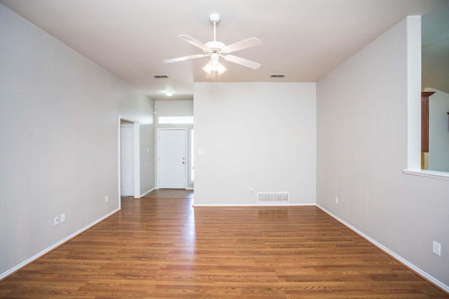 3606 Pontiac Avenue Lubbock, TX 79407 - Photo 4 of 17 a view of an empty room with wooden floor