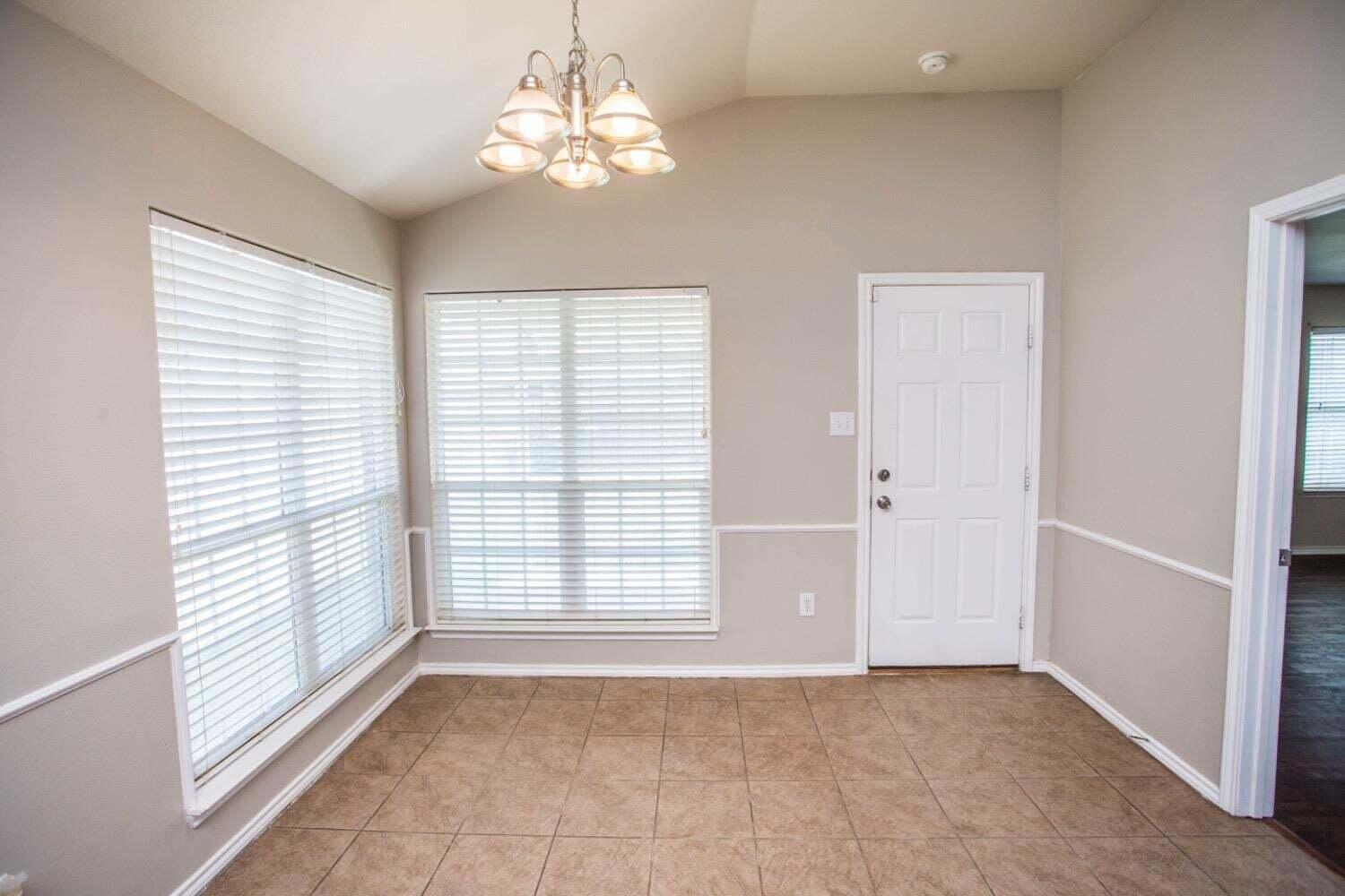 3606 Pontiac Avenue Lubbock, TX 79407 - Photo 7 of 17 a view of an empty room with a window