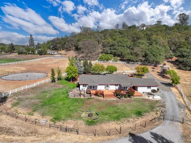 an aerial view of a house with a garden