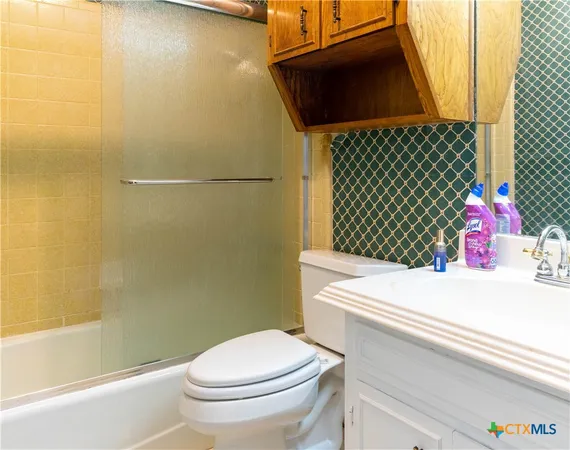 a view of a bathroom with a washer and dryer