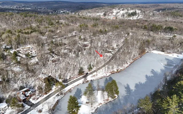 a view of snow on the side of a road