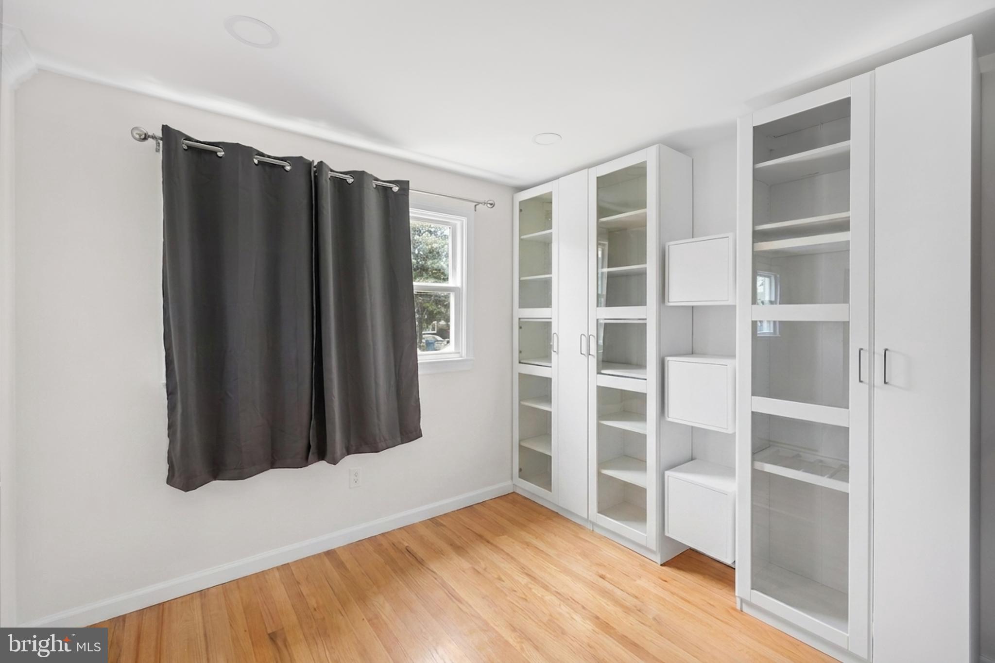 7402 Dunston Street Springfield, VA 22151 - Photo 27 of 37 a view of closet area with empty racks