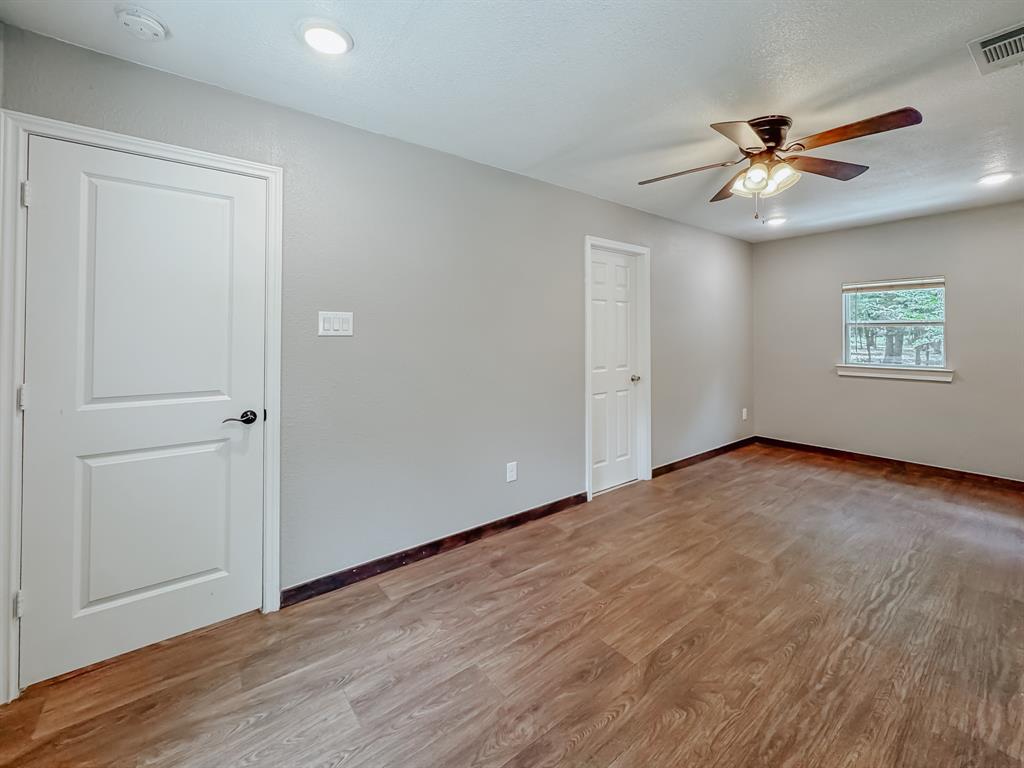325 Fcr, Unit 1211 Fairfield, TX 75840 - Photo 12 of 28 a view of an empty room with wooden floor