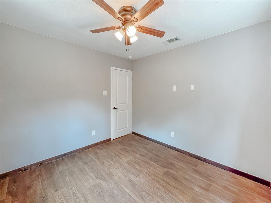325 Fcr, Unit 1211 Fairfield, TX 75840 - Photo 19 of 28 wooden floor in an empty room