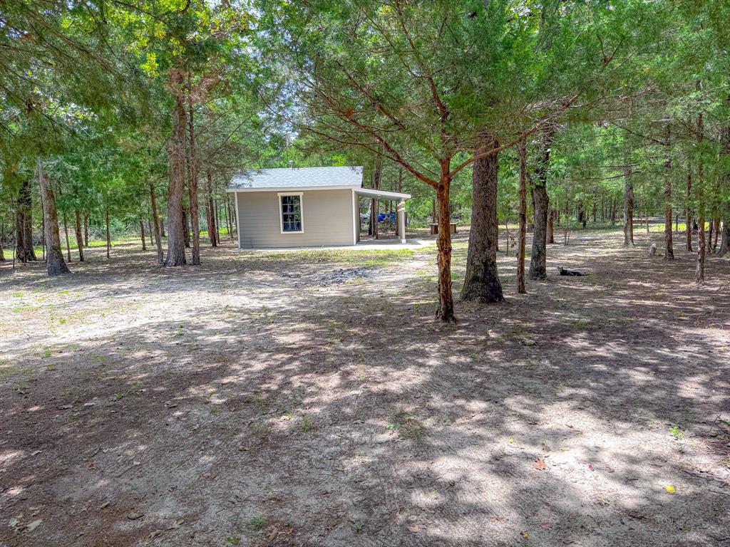 325 Fcr, Unit 1211 Fairfield, TX 75840 - Photo 2 of 28 a view of a house with backyard and trees