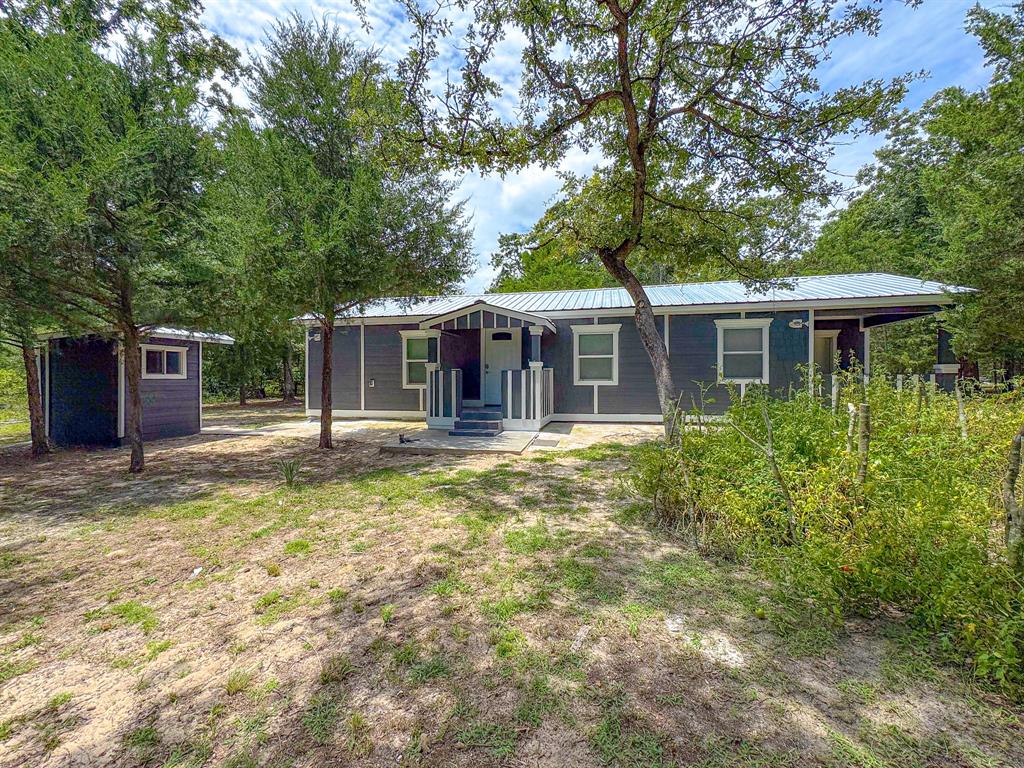 325 Fcr, Unit 1211 Fairfield, TX 75840 - Photo 25 of 28 a front view of a house with a garden