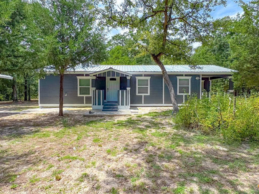 325 Fcr, Unit 1211 Fairfield, TX 75840 - Photo 4 of 28 a backyard of a house with yard and tree