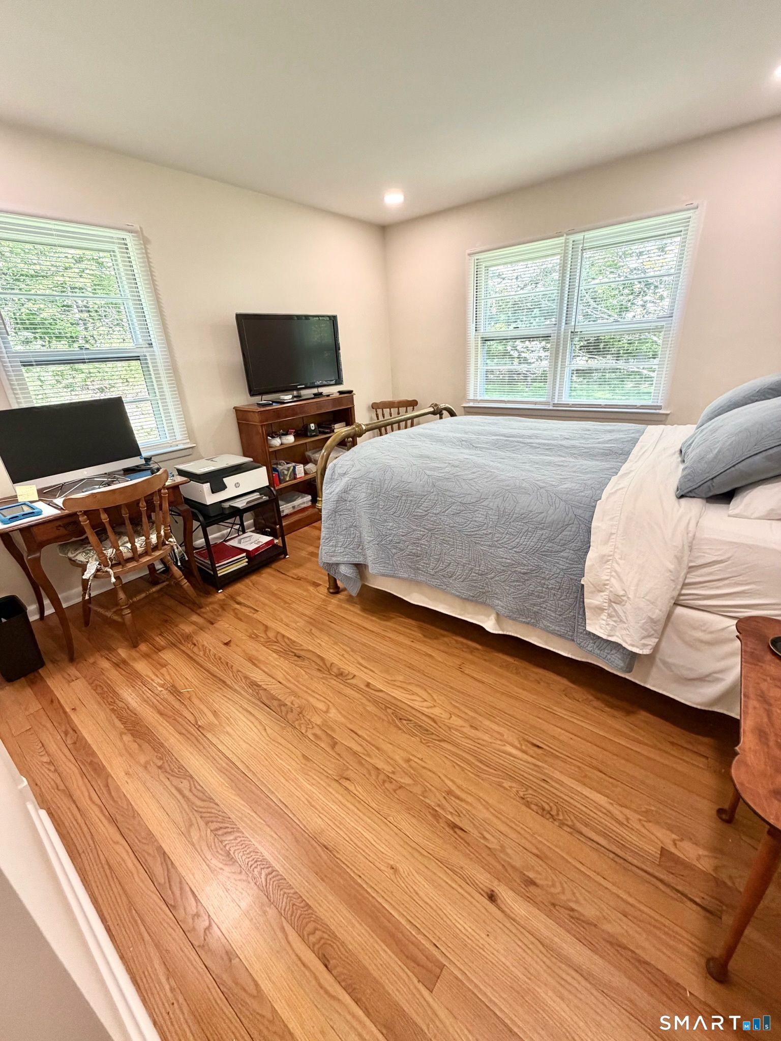 511 Roxbury Road Stamford, CT 06902 - Photo 12 of 19 a bedroom with a bed and a flat screen tv