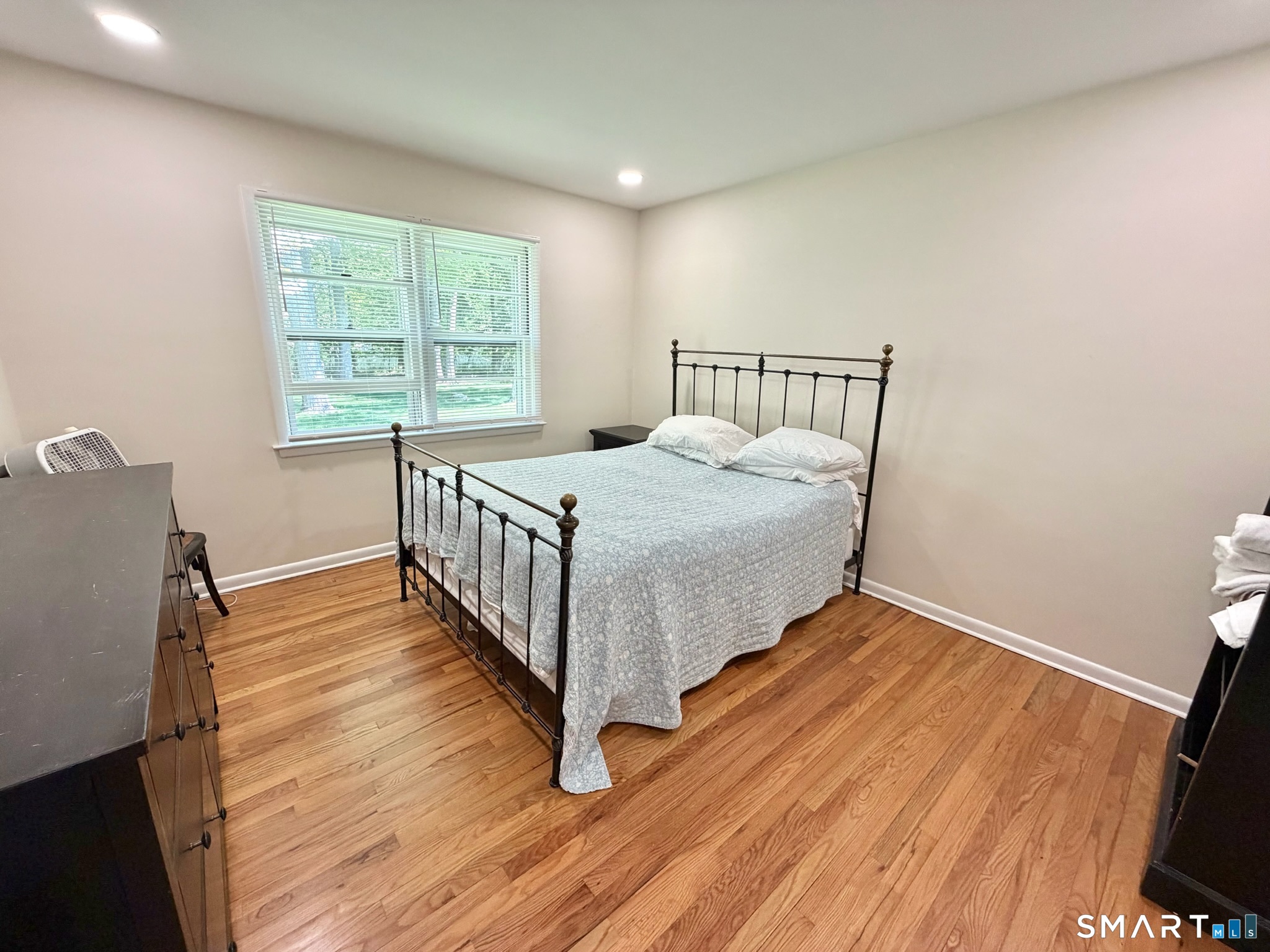 511 Roxbury Road Stamford, CT 06902 - Photo 13 of 19 a bedroom with a bed and a window