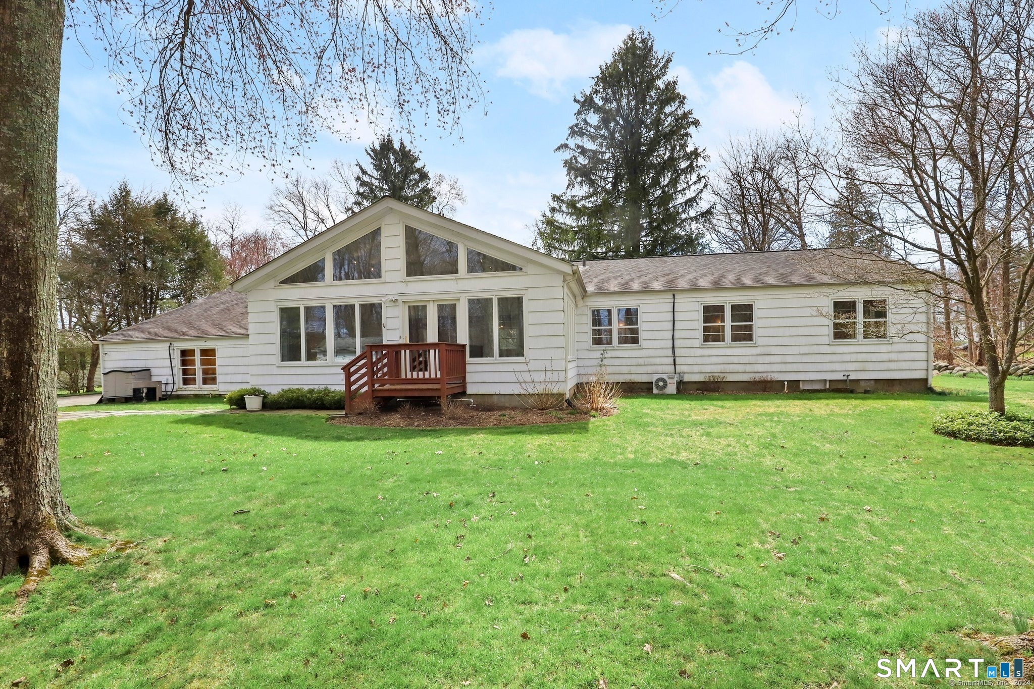 511 Roxbury Road Stamford, CT 06902 - Photo 16 of 19 a front view of a house with a garden
