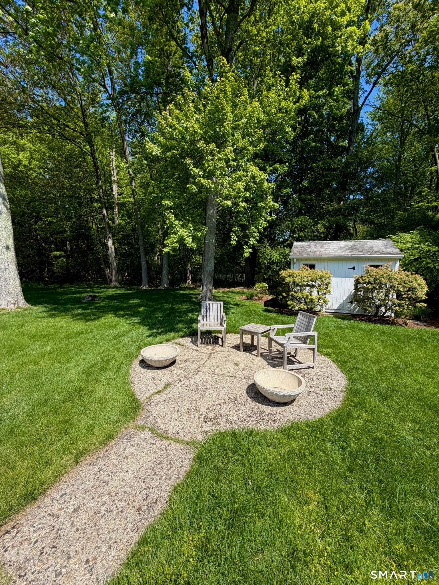 511 Roxbury Road Stamford, CT 06902 - Photo 17 of 19 a view of a backyard with sitting area
