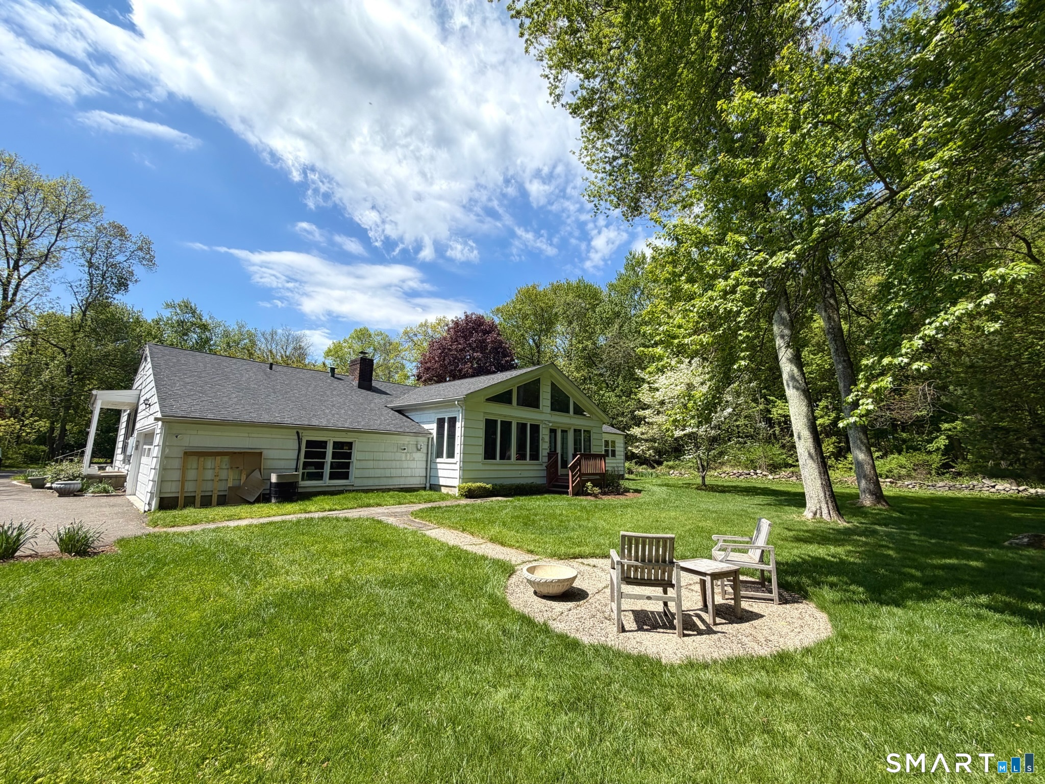 511 Roxbury Road Stamford, CT 06902 - Photo 18 of 19 a view of a house with a yard porch and sitting area