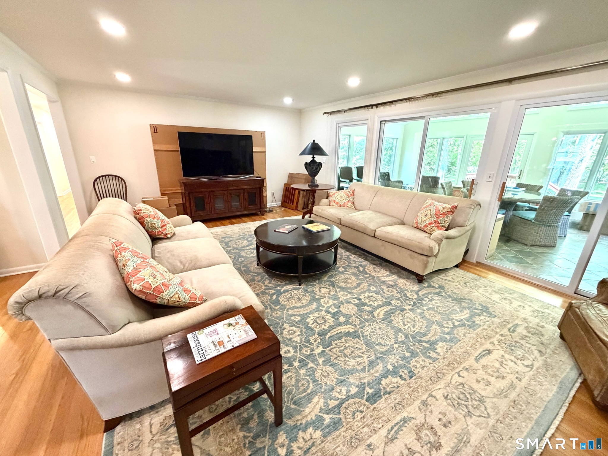 511 Roxbury Road Stamford, CT 06902 - Photo 3 of 19 a living room with furniture and a flat screen tv
