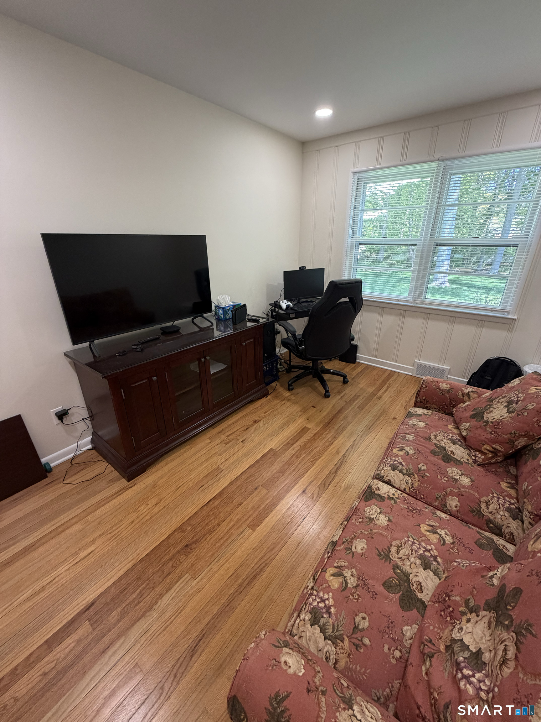 511 Roxbury Road Stamford, CT 06902 - Photo 9 of 19 a living room with furniture and a flat screen tv