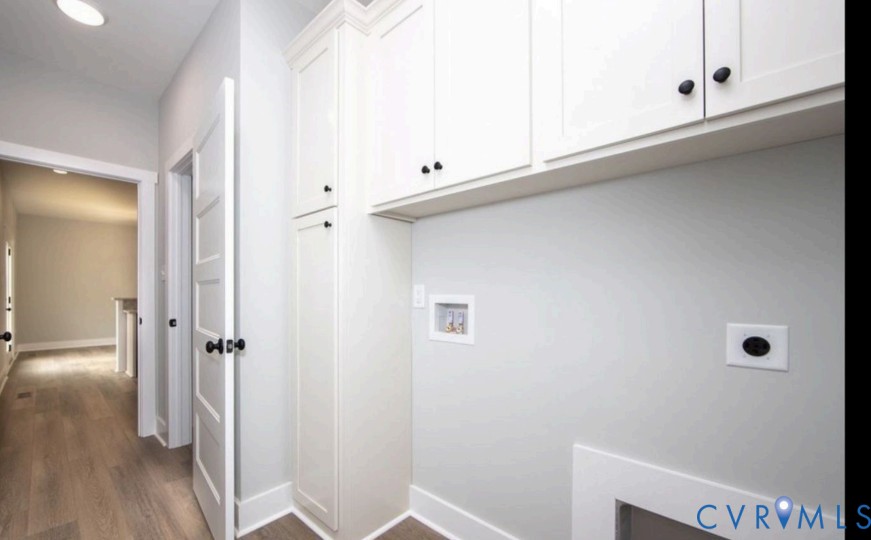 115 Jenkins Church Road Cumberland, VA 23040 - Photo 14 of 16 Laundry area with white shaker-style cabinetry, ta