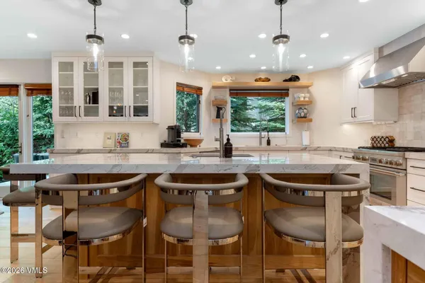 a kitchen with a table and chairs in it