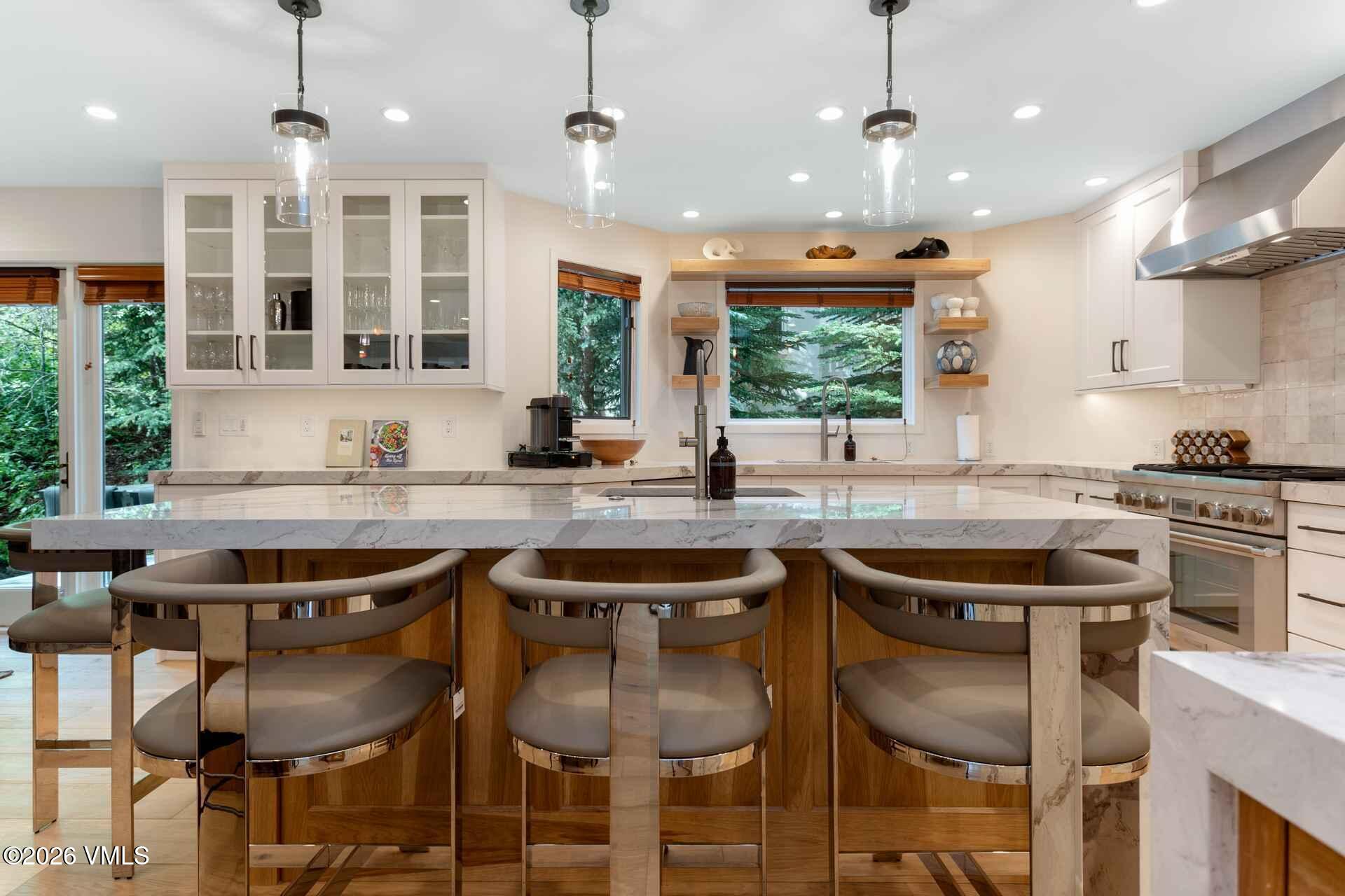 1592 Golf Terrace, Unit 55 Vail, CO 81657 - Photo 13 of 34 a kitchen with a table and chairs in it