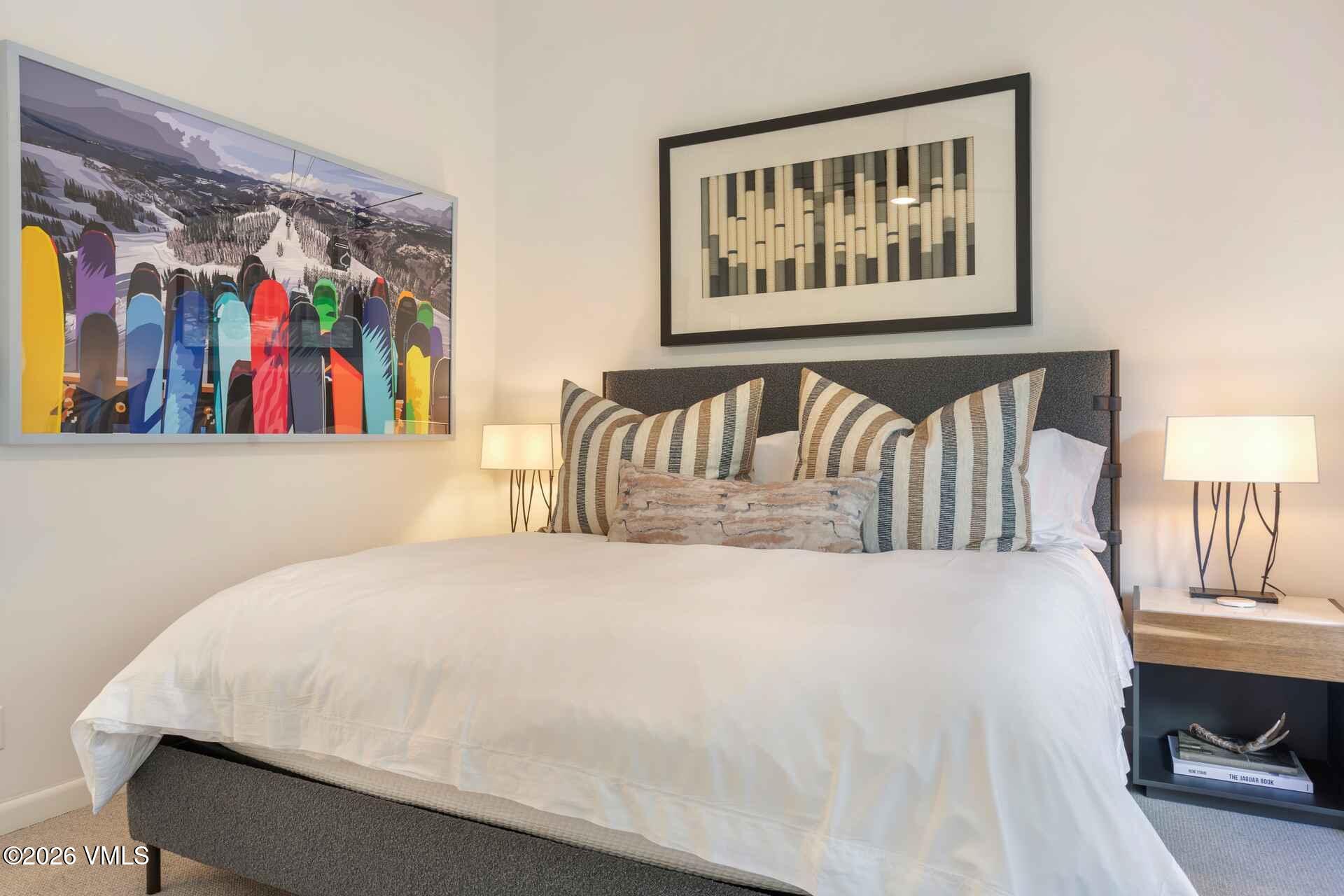 1592 Golf Terrace, Unit 55 Vail, CO 81657 - Photo 30 of 34 a bedroom with a bed and a painting on the wall