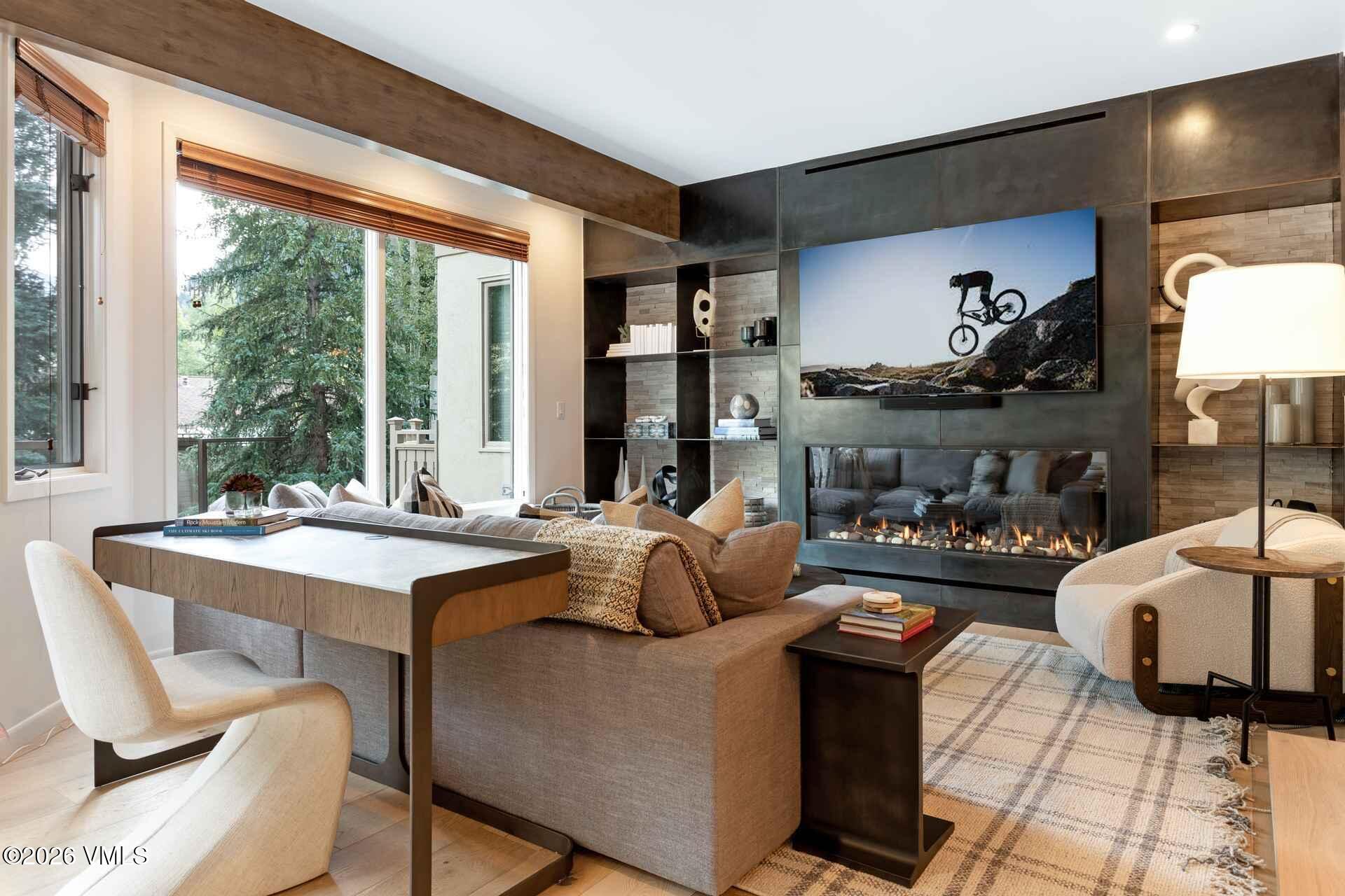 1592 Golf Terrace, Unit 55 Vail, CO 81657 - Photo 4 of 34 a dining room with furniture and a large window