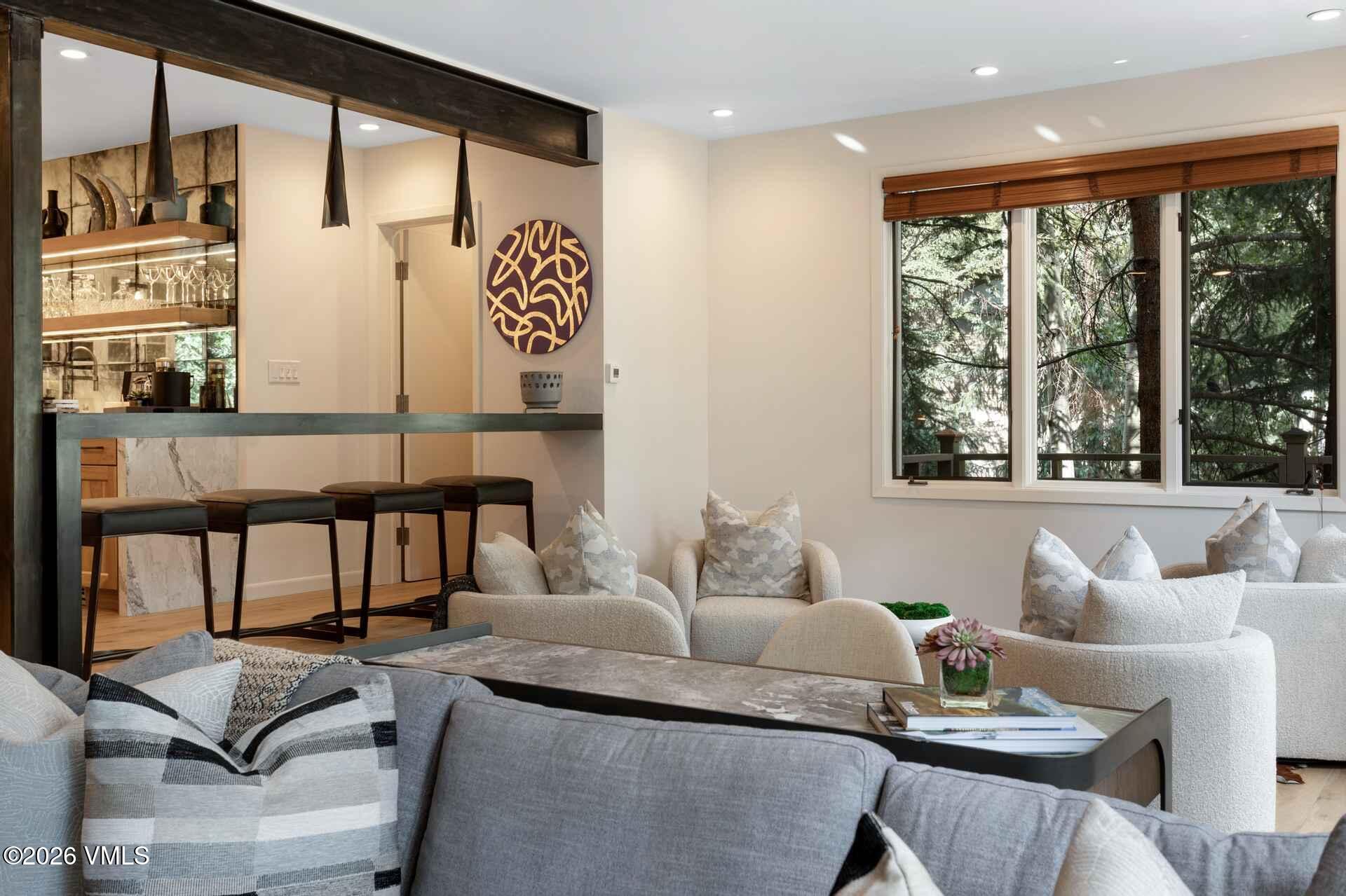 1592 Golf Terrace, Unit 55 Vail, CO 81657 - Photo 7 of 34 a living room with furniture and large window
