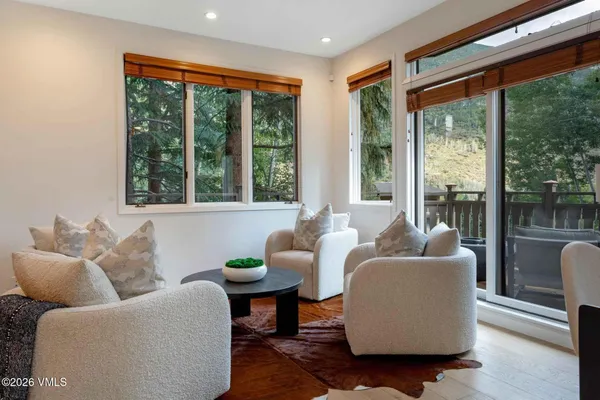 a living room with furniture and a large window
