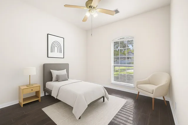 a bedroom with a bed and a couch