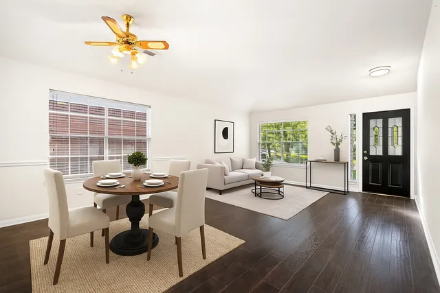 a dining room with furniture and wooden floor