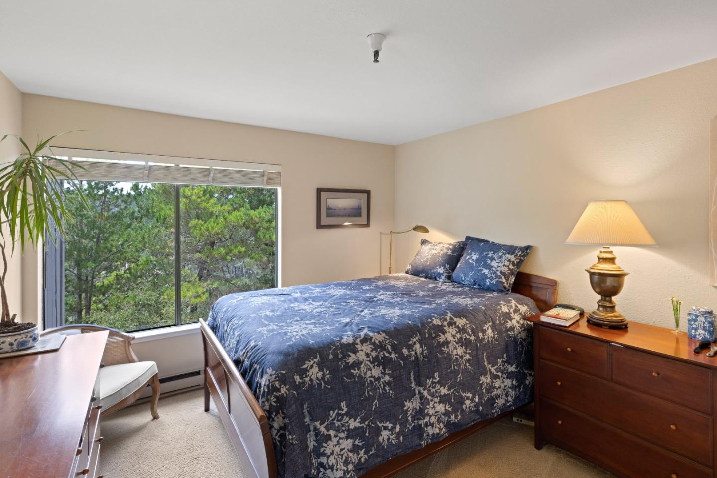 22 Shepherds Knoll Road Monterey, CA 93940 - Photo 13 of 21 a bed sitting in a bedroom next to a window