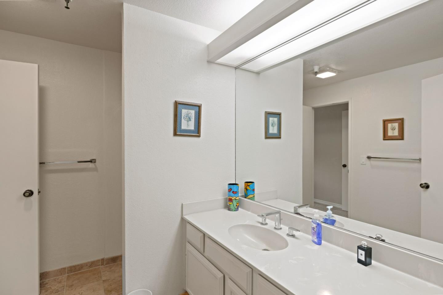22 Shepherds Knoll Road Monterey, CA 93940 - Photo 16 of 21 a bathroom with a sink vanity and a mirror
