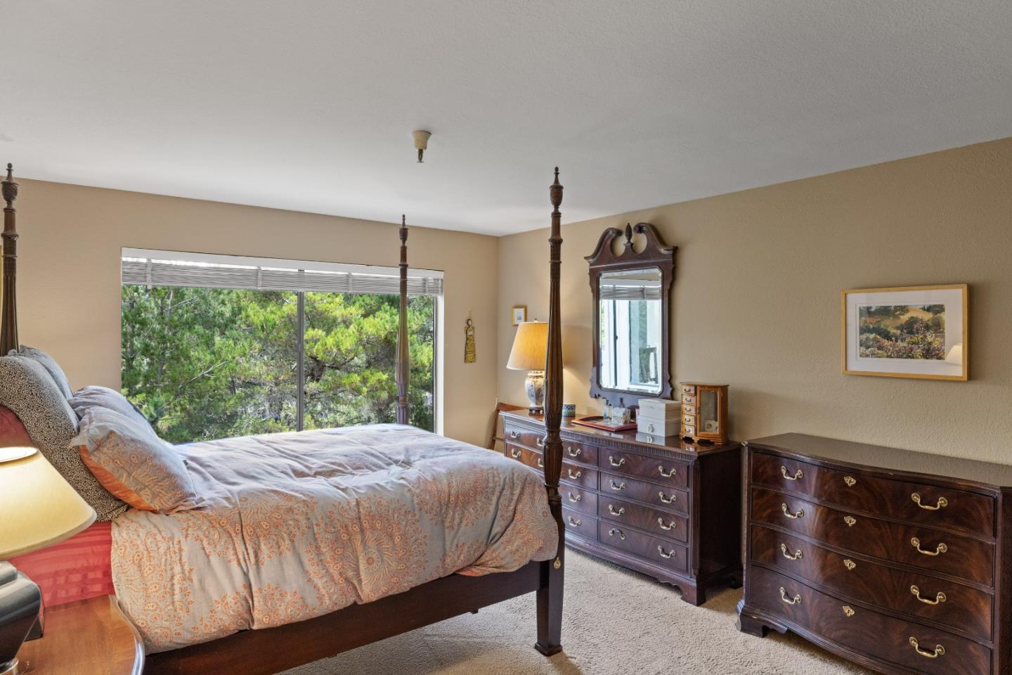 22 Shepherds Knoll Road Monterey, CA 93940 - Photo 17 of 21 a bedroom with a large bed and a dresser next to a window