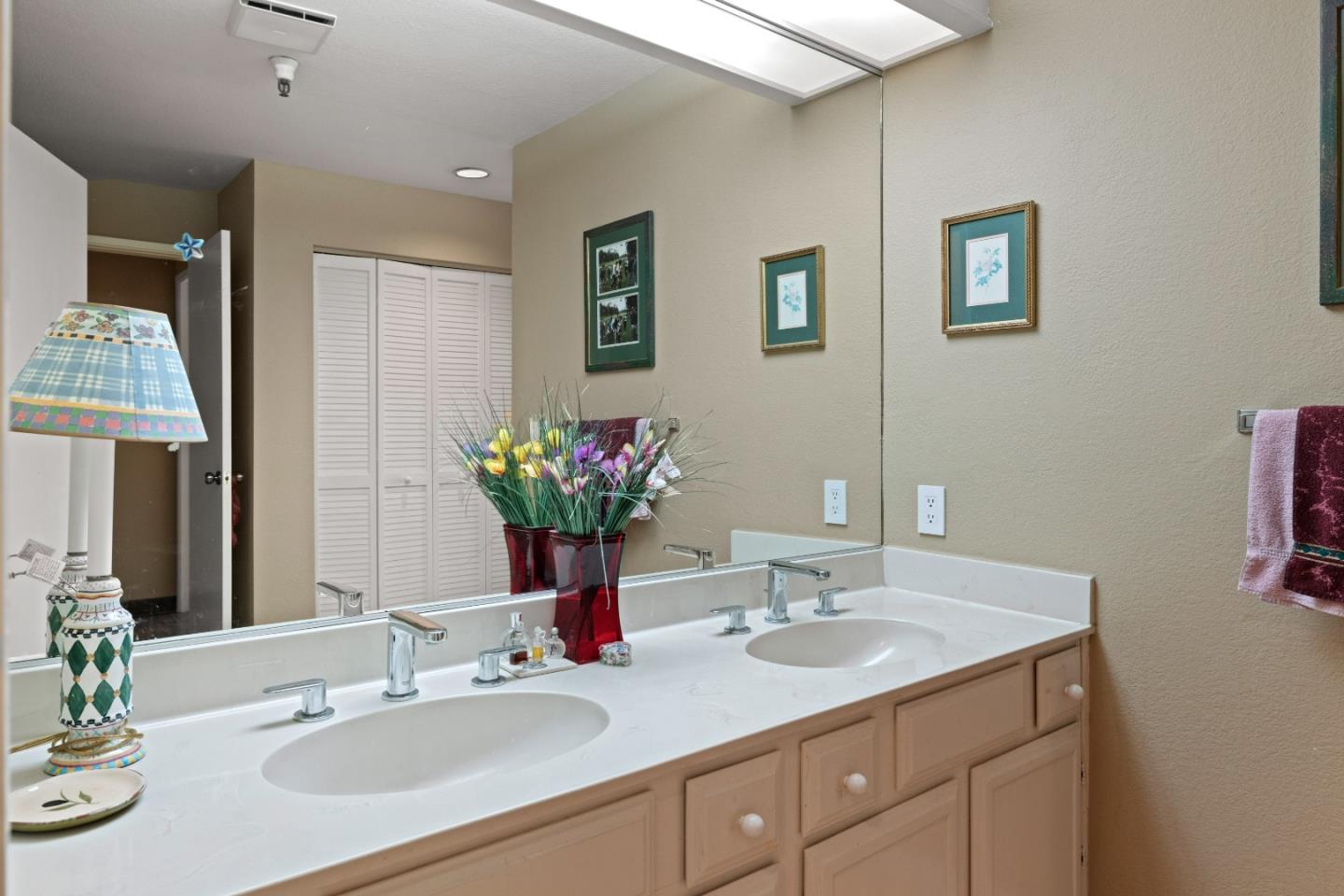 22 Shepherds Knoll Road Monterey, CA 93940 - Photo 18 of 21 a bathroom with a granite countertop sink and a mirror