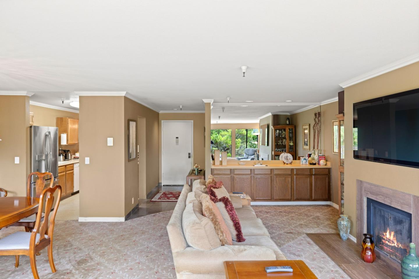 22 Shepherds Knoll Road Monterey, CA 93940 - Photo 5 of 21 a living room with furniture a flat screen tv and a fireplace