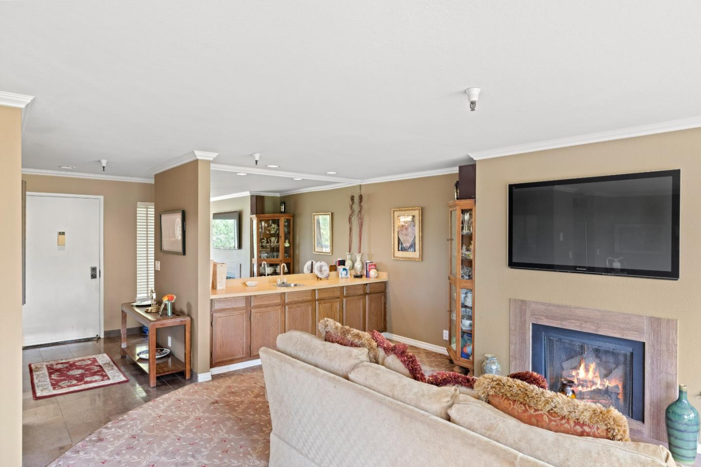 22 Shepherds Knoll Road Monterey, CA 93940 - Photo 8 of 21 a living room with furniture a fireplace and a flat screen tv